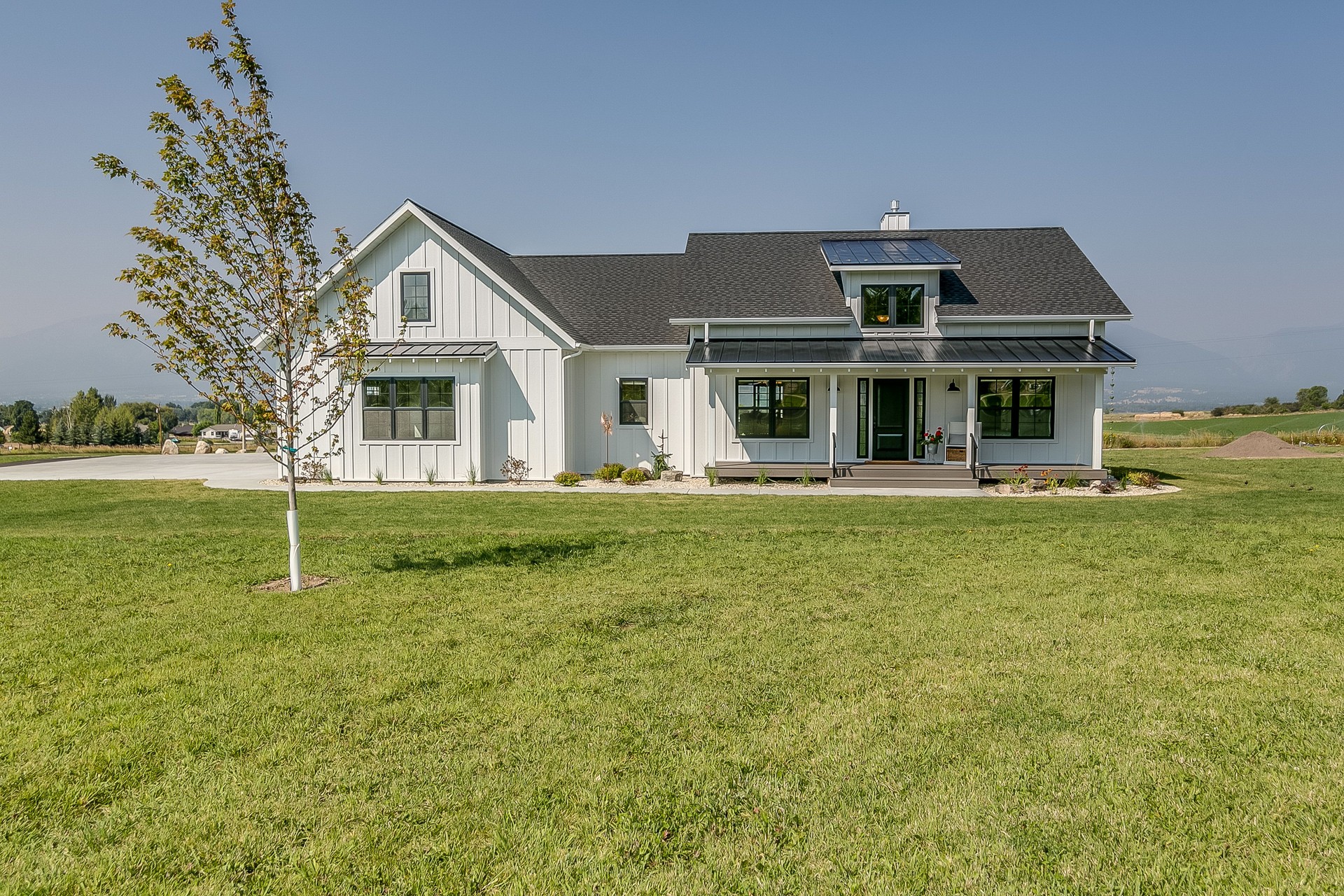 White modern farmhouse on large property